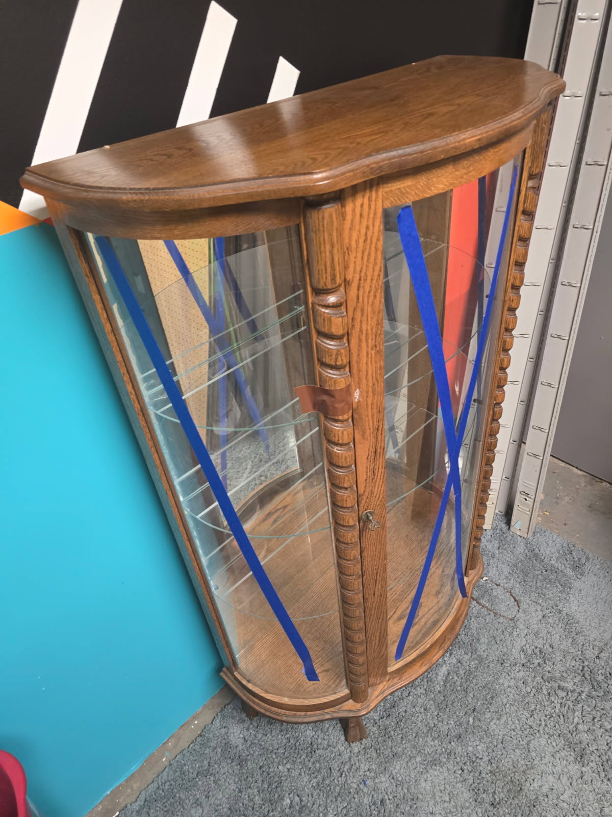 Vintage Curio Display Cabnit with Glass Panels and Wooden Fram